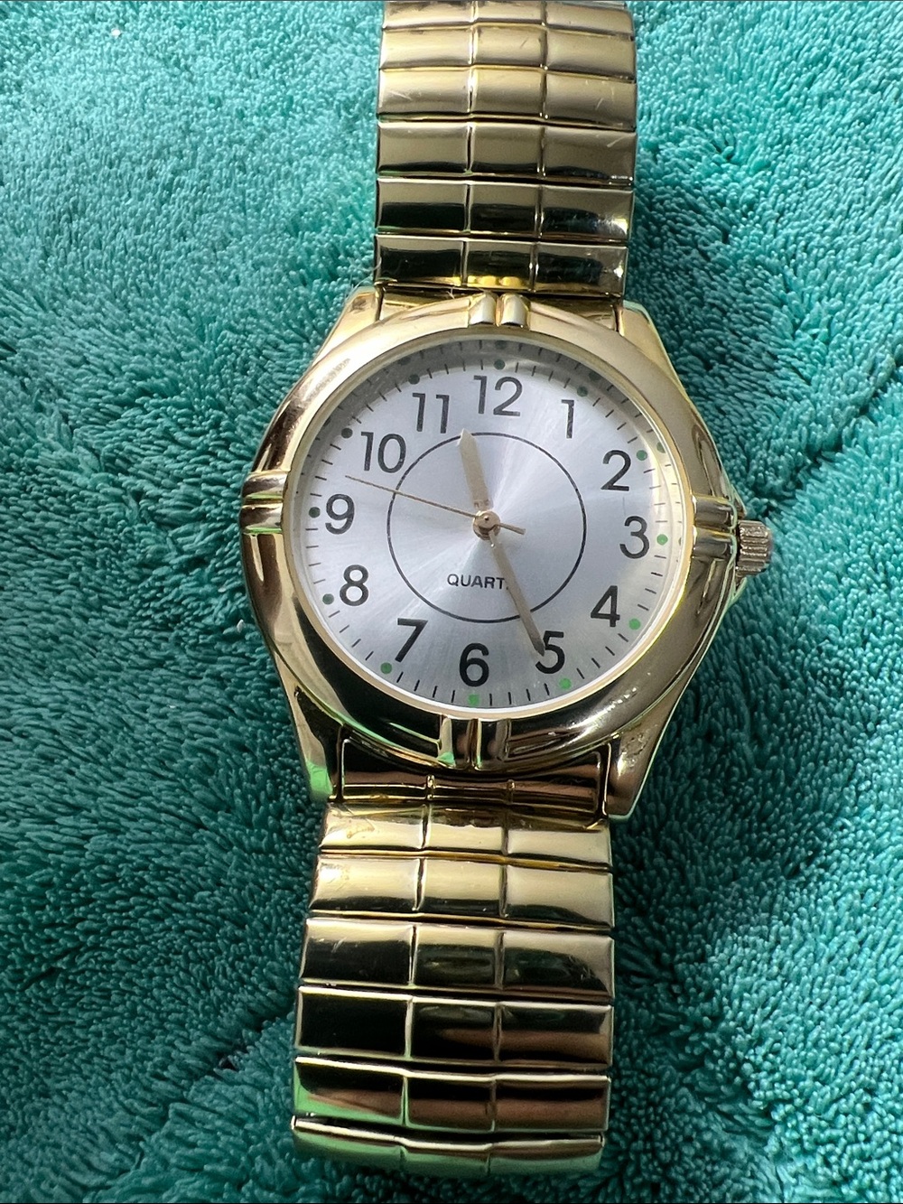This is a Puritan classic gold-tone easy-reader quartz wristwatch